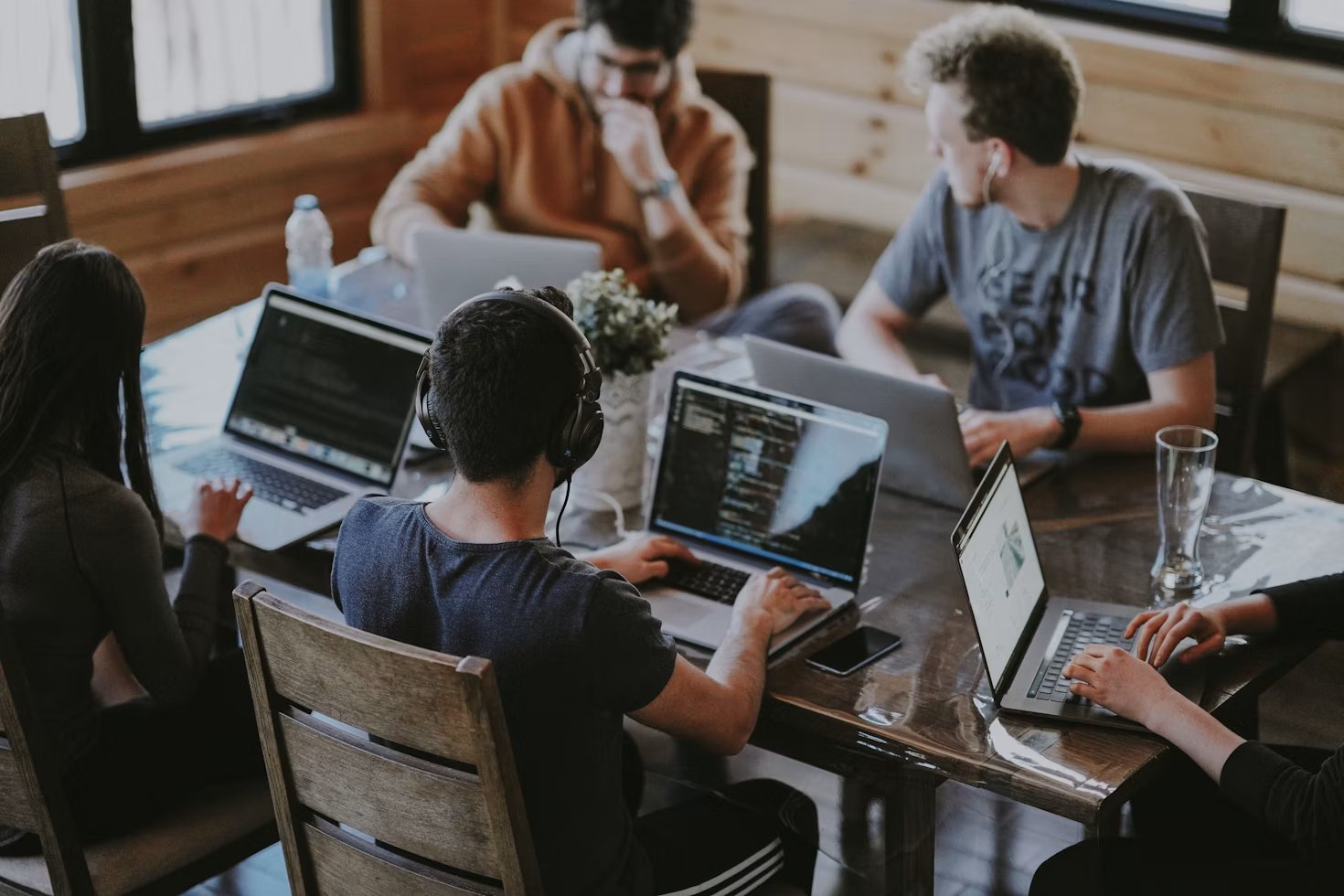 Team working together on laptops in an office